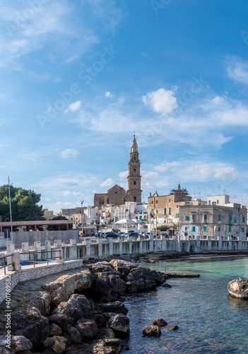 Monopoli harbor in the Metropolitan City of Bari and region of Apulia ( Puglia ) , Italy and beautiful cathedral Basilica Concattedrale Maria Santissima della Madia