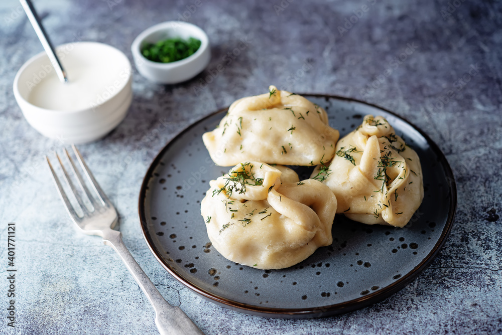 Steamed manta rays with meat sprinkled with dill in a plate Steamed manta rays with meat sprinkled with dill in a plate
