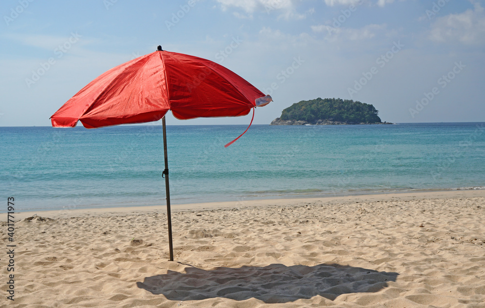 Red beach umbrella on Kata Karon beach at  phuket thailand