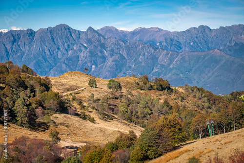 View of the mountain range surrounding the Val Grande valley (Piedmont Northern Italy), from the top of Mottarone mountain. It's a large wild area, near the borders between Italy and Switzerland. photo