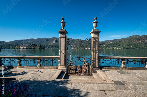 Early fall view of the Orta Lake (piedmont, Northern Italy) seen from the city of Orta, alog the lake shores. UNESCO World Heritage Site, it is home to a convent of cloistered nuns