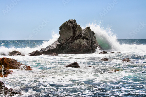 Waves crashing on rocks