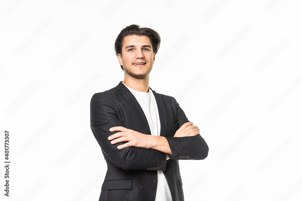 Smiling businessman standing with arms folded on a white background Smiling businessman standing with arms folded on a white background