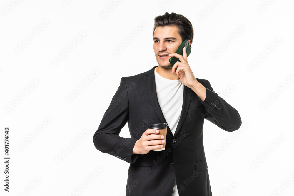 Portrait of positive agent man have work relax time hold take-out coffee mug speak on cell phone colleagues family friends wear black pants blazer jacket grey background Portrait of positive agent man have work relax time hold take-out coffee mug speak on cell phone colleagues family friends wear black pants blazer jacket grey background