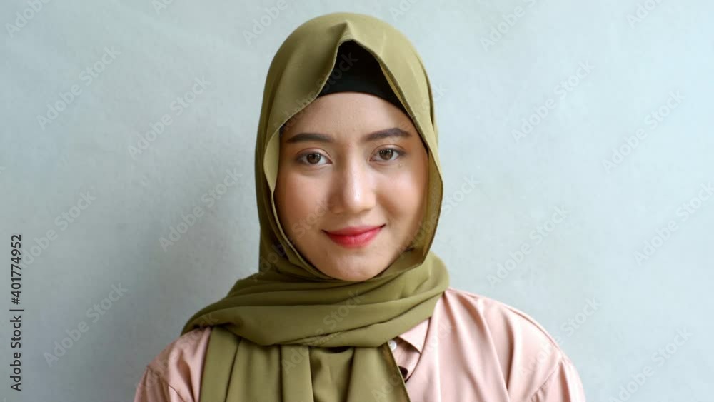 Close Up Portrait of a Young Asian Muslim Woman dressing in the ...