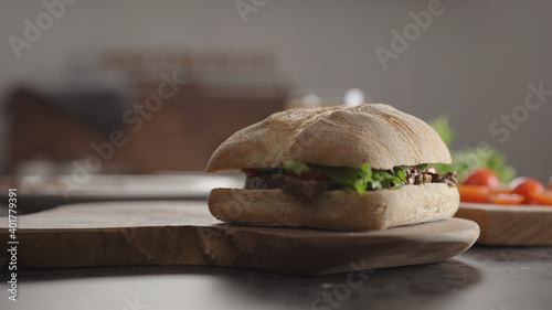 steak ciabatta sandwich on kitchen countertop