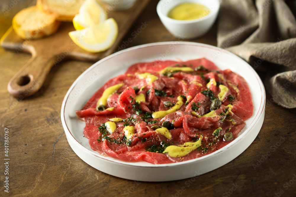 Homemade beef carpaccio with mustard sauce Homemade beef carpaccio with mustard sauce