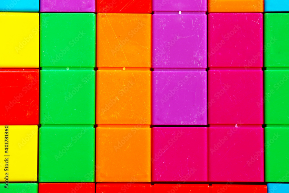 Colorful puzzle cubes background, geometric figures, table game