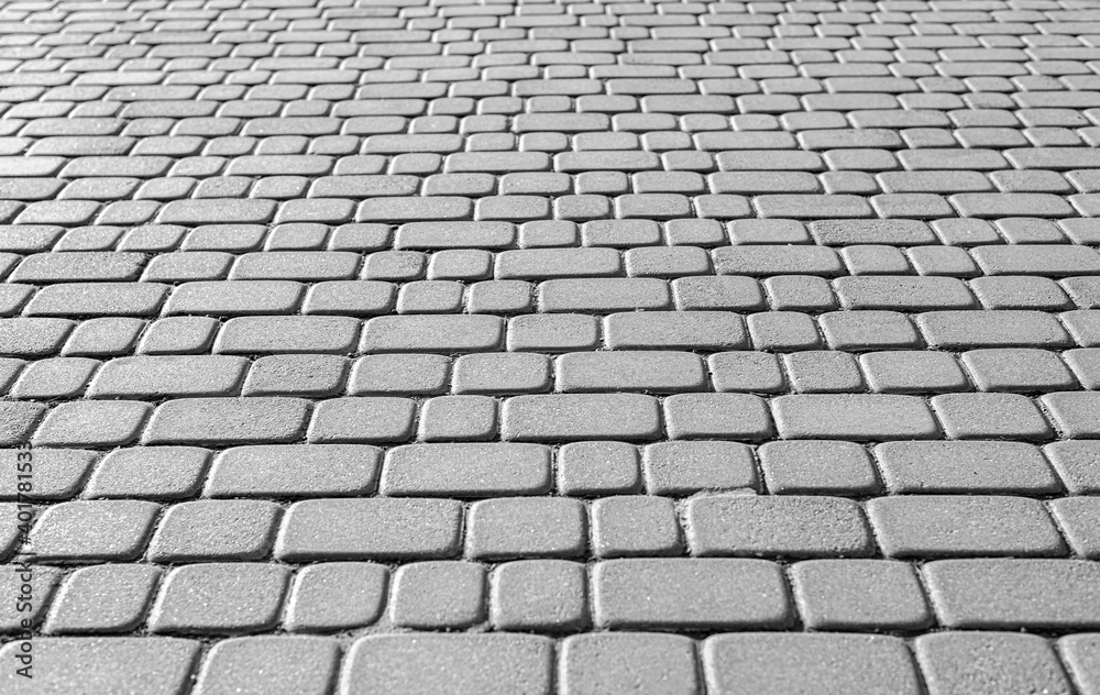 Gray stone paving stones as an abstract background.