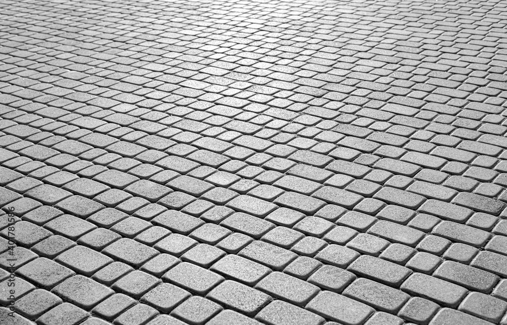 Gray stone paving stones as an abstract background.