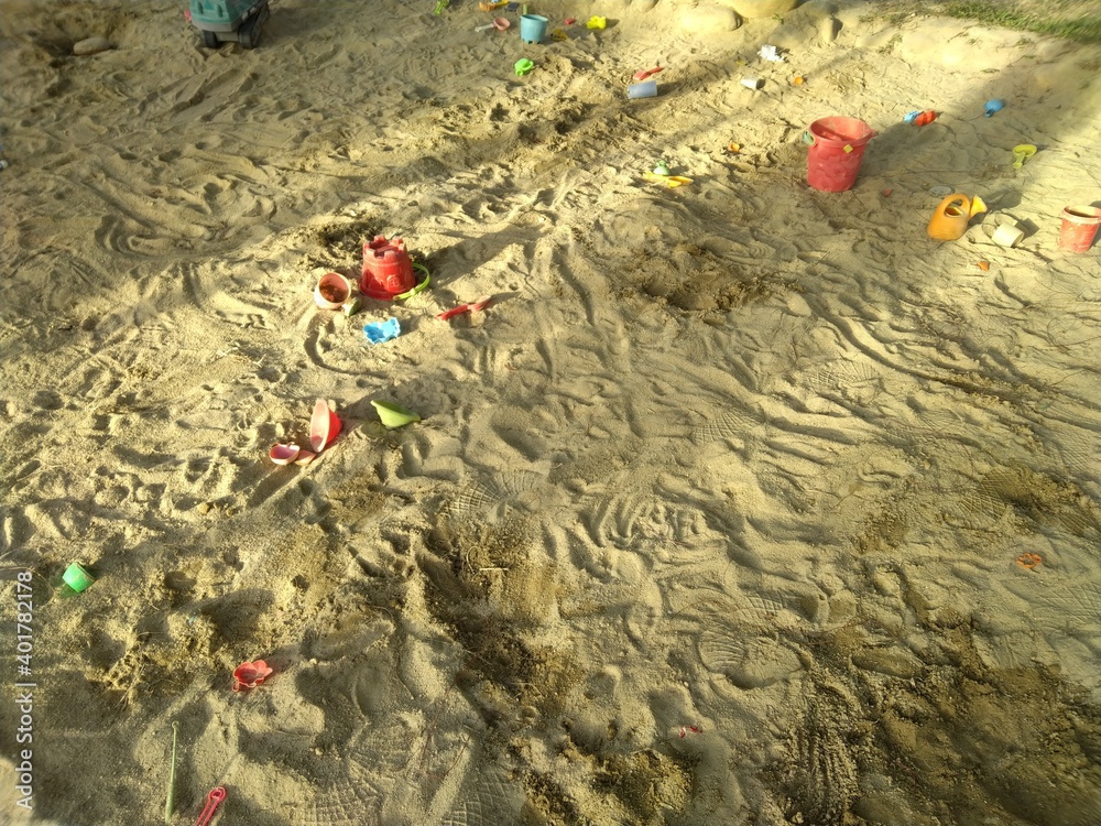 many colorful and various plastic tools in the sandpit for children to play all the time