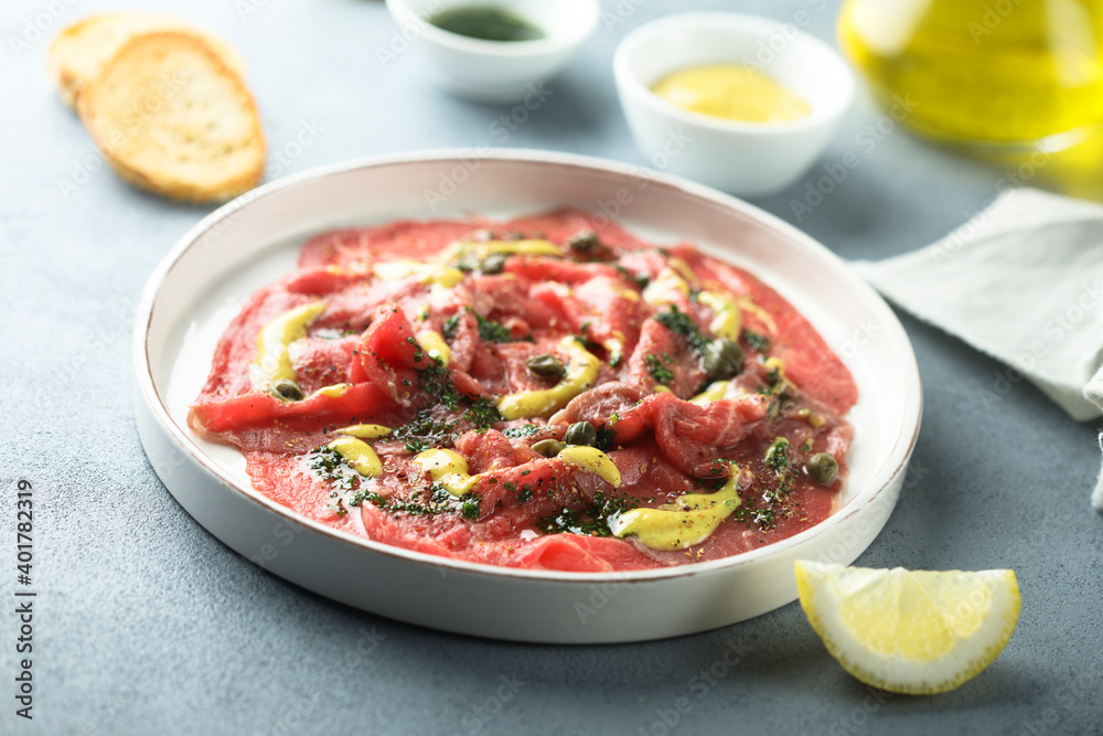 Homemade beef carpaccio with mustard sauce Homemade beef carpaccio with mustard sauce