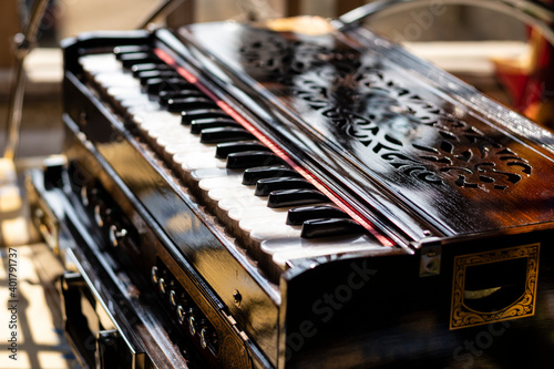 wooden musical instrument - harmonium photo