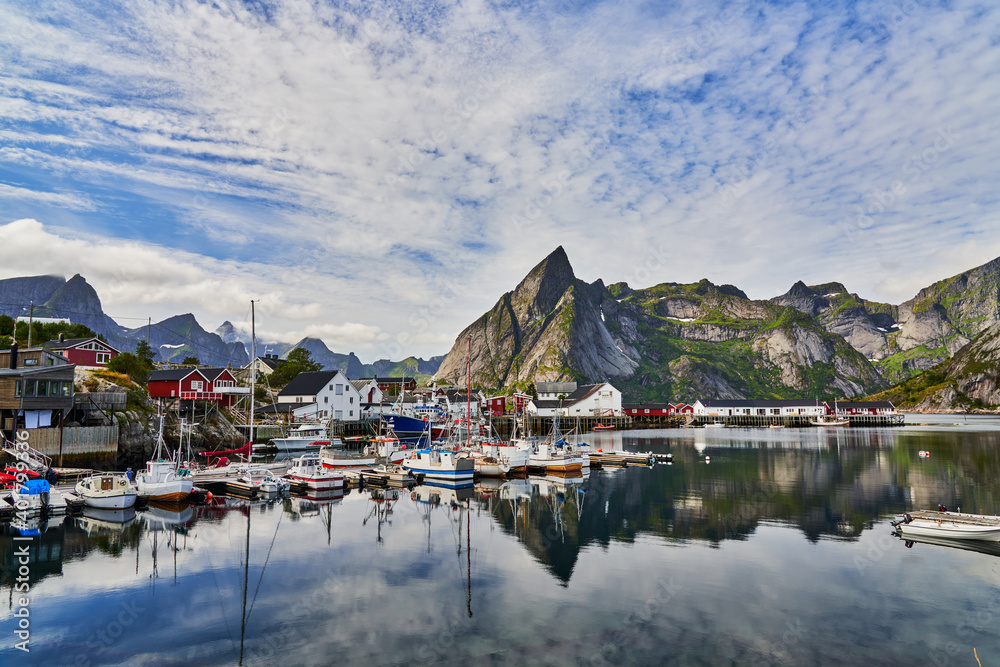 Port of Reine Moskenesoy in Lofoten in Norway with various fishing boats and houses