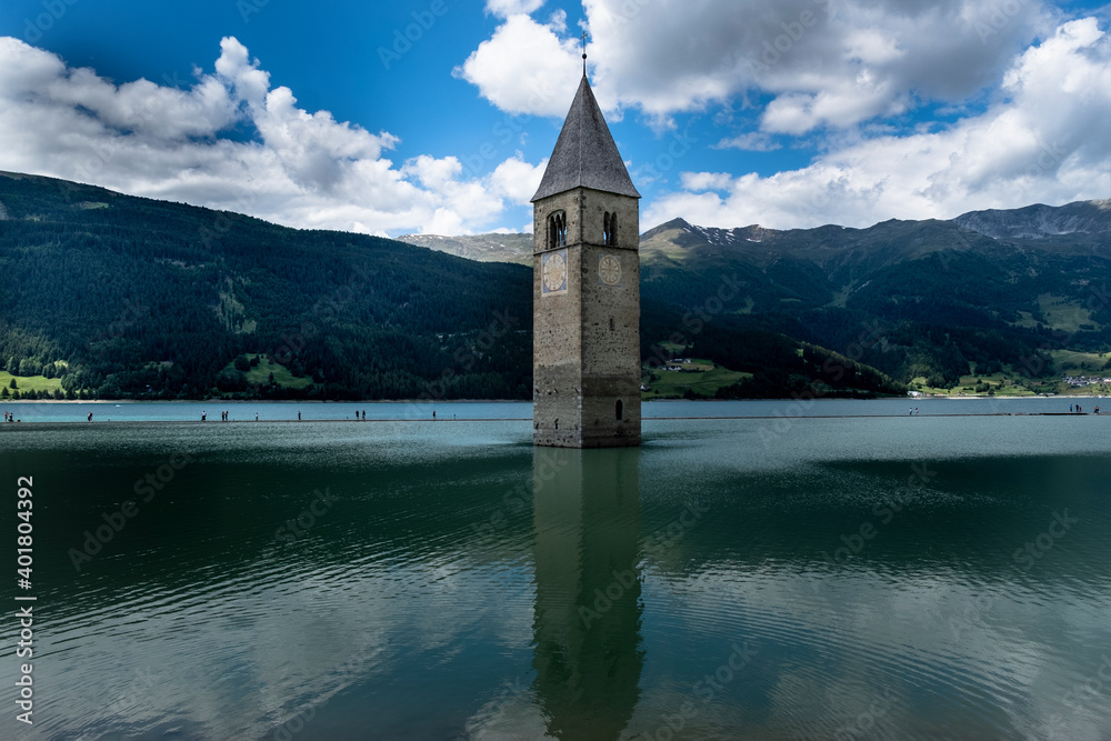 Campanile di Curon Venosta, or the bell tower of Alt-Graun, Italy. Reschensee, clock.