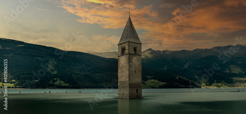 Campanile di Curon Venosta, or the bell tower of Alt-Graun, Italy. Reschensee, clock.