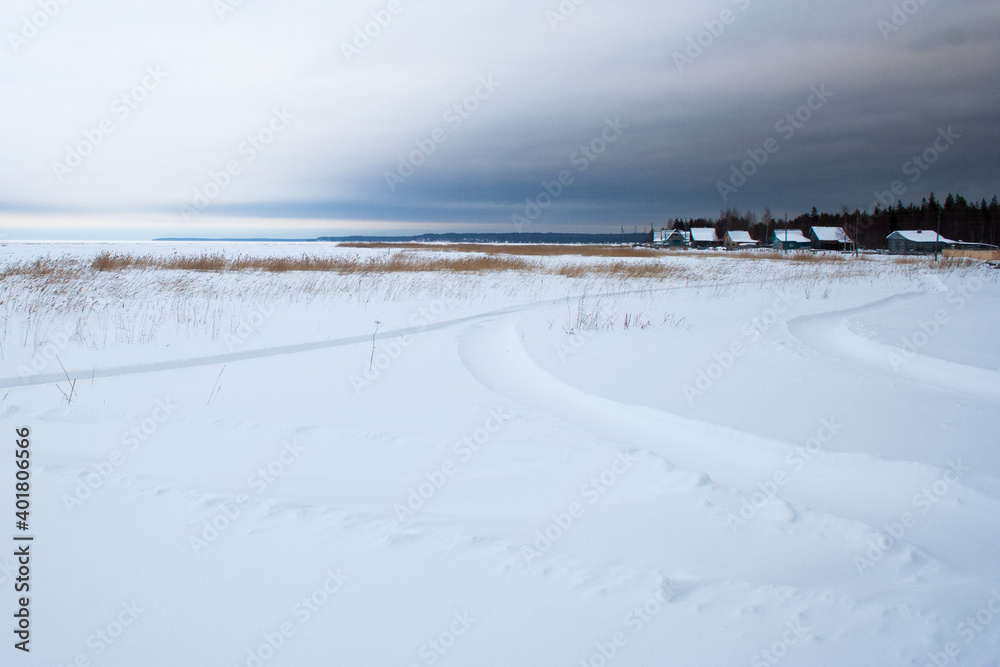 Village at the covered with snow seaside