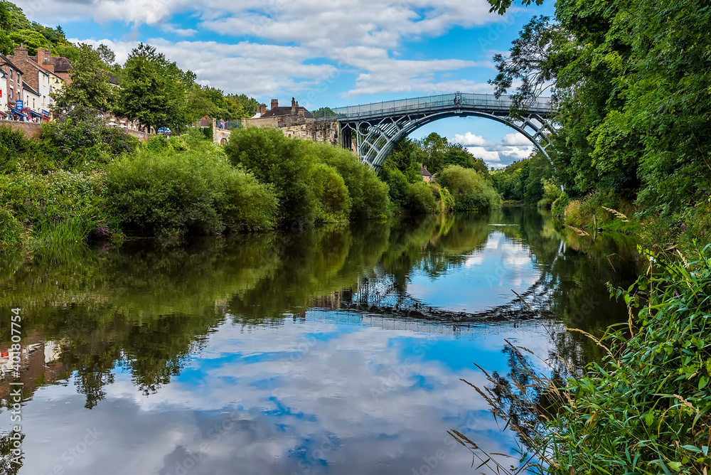 The view down the River Severn of the town of Ironbridge, Shropshire, UK and the bridge that gave it its name