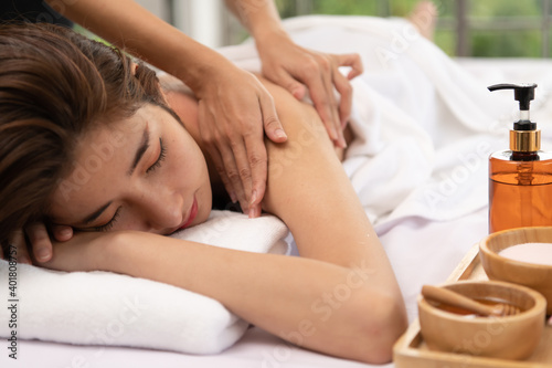 Portrait of young beautiful asian woman enjoys massage in a luxury spa resort