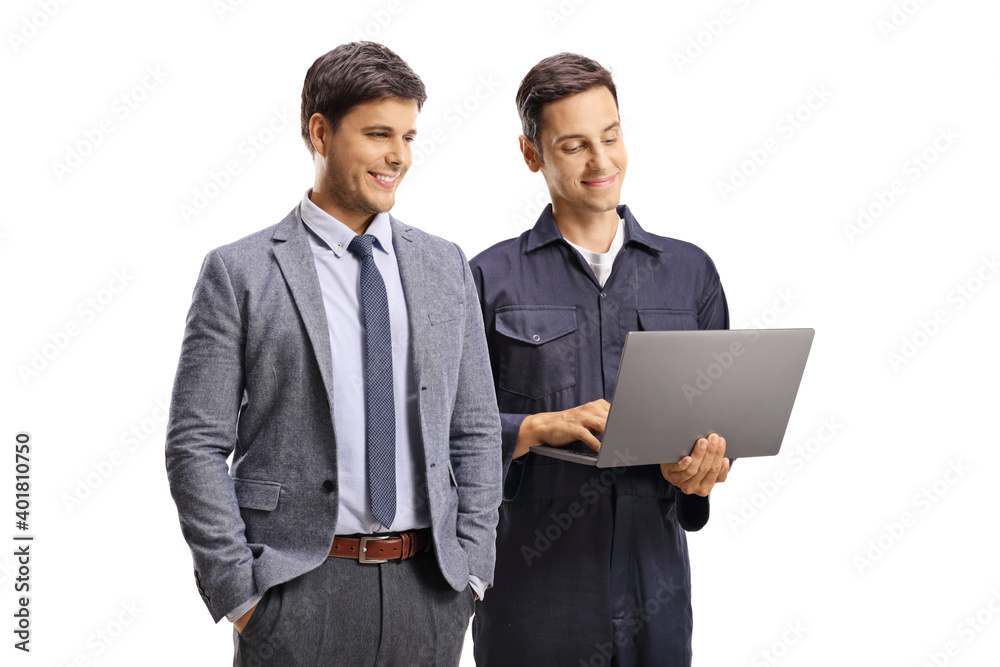 Businessman and a worker in a uniform with a laptop computer Businessman and a worker in a uniform with a laptop computer