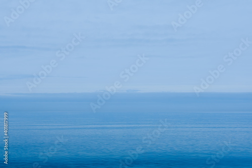 view of the sea and blue sky, baltic sea in winter, cold blue color concept on the beach