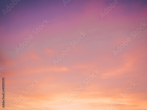 Fototapeta Naklejka Na Ścianę i Meble -  Abstract idyllic winter frosty orange and purple sky. Soft, fluffy and colorful cloud formation. Blur background texture of colorful sunset. Twilight sky. Fresh air, weather concept