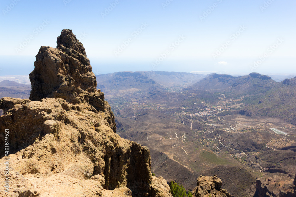 Obraz premium Top view of Pico de las Nieves on sunny day in Gran Canaria, Spain. Mountain peak natural landscape in Canary Islands. Tourist attraction, climb, hiking, outdoor activity concepts