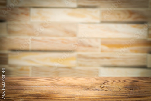 Empty rough wooden table with blurred background for product showcase with place for text or photo