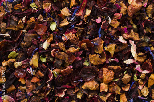 Close up of loose fruit tea  full frame  dried flowers and leaves  background © Maria