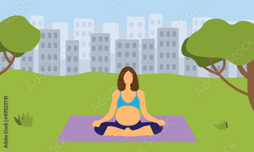 Pregnant woman doing yoga in park