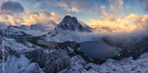 A mesmerizing shot of the mount Assiniboine Provincial Park under the bright sky in the evening photo