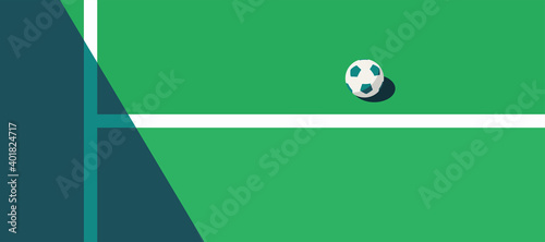 soccer ball standing near the center line on the green field