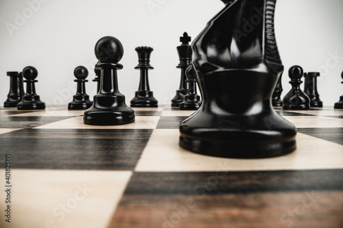 Obraz na plátne Macro photo of chess pieces on a chess board