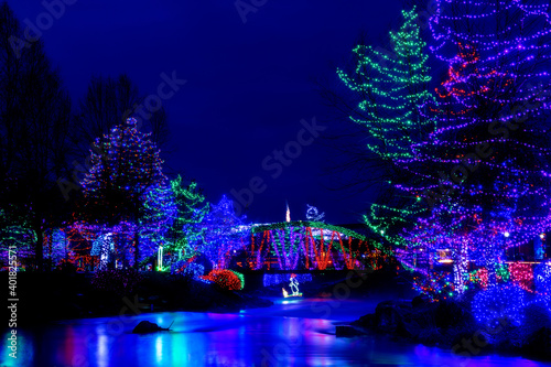 Christmas celebration with lights bridge and creek photo