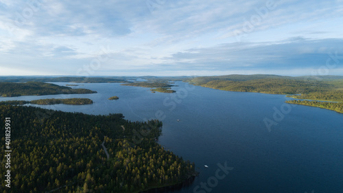 Aerial vibrant summer view of an island and skerries in the lake Inari, scandinavian landscape, shot from drone © raland