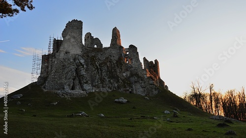 Majestic gothic castle Hrusov with renaissance extensions  in winter evening sunshine. There is restoration scaffolding visible on eastern side of the castle.