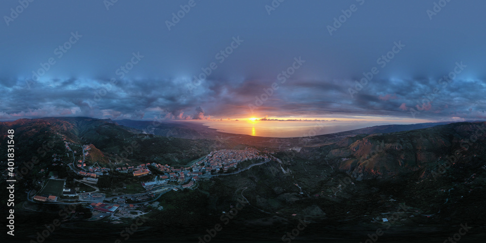 360 degree virtual reality panorama of a small village type perched on the mountains facing the sea during sunset over Nebrodi, Sicily, Italy.