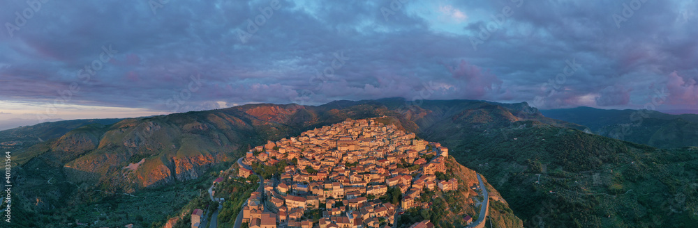 180 degree virtual reality panorama of a small village type perched on the mountains facing the sea during sunset over Nebrodi, Sicily, Italy.