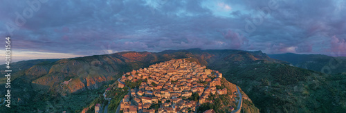 Wallpaper Mural 180 degree virtual reality panorama of a small village type perched on the mountains facing the sea during sunset over Nebrodi, Sicily, Italy. Torontodigital.ca