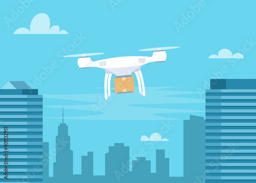 Delivery drone with the cardboard box flying over the town. Quadcopter carrying a package to customer. Technological shipment innovation. Drone delivery service.