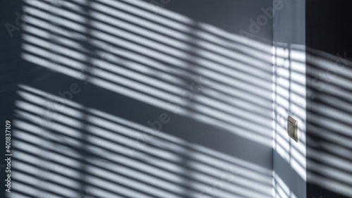 Shadows on wall. Abstract light, black shadow overlay from window on white texture wall. Sunlight architecture background. For product presentation, backdrop and mockup, summer seasonal concept. photo