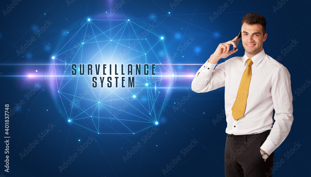 Businessman thinking about security solutions with SURVEILLANCE SYSTEM inscription Businessman thinking about security solutions with SURVEILLANCE SYSTEM inscription
