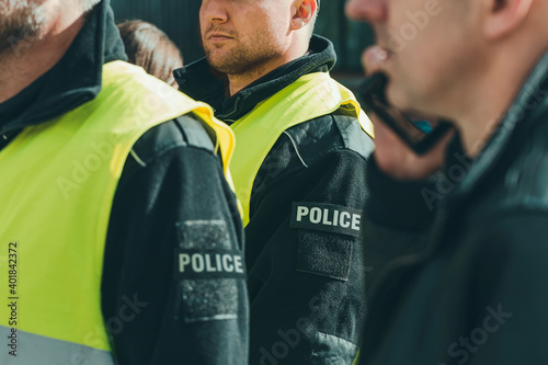 Group of police officers heading for intervention on the city streets