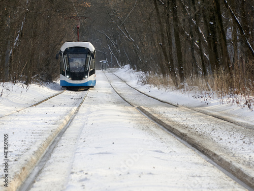 White tram in the Sokolniki winter park in Moscow