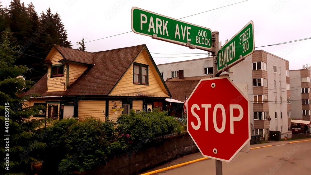Ketchikan, Alaska US: Road signs and houses in typical Alaskan neighborhood