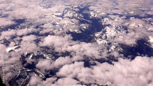 Airplane window view on a beautiful Canadian mountain peaks