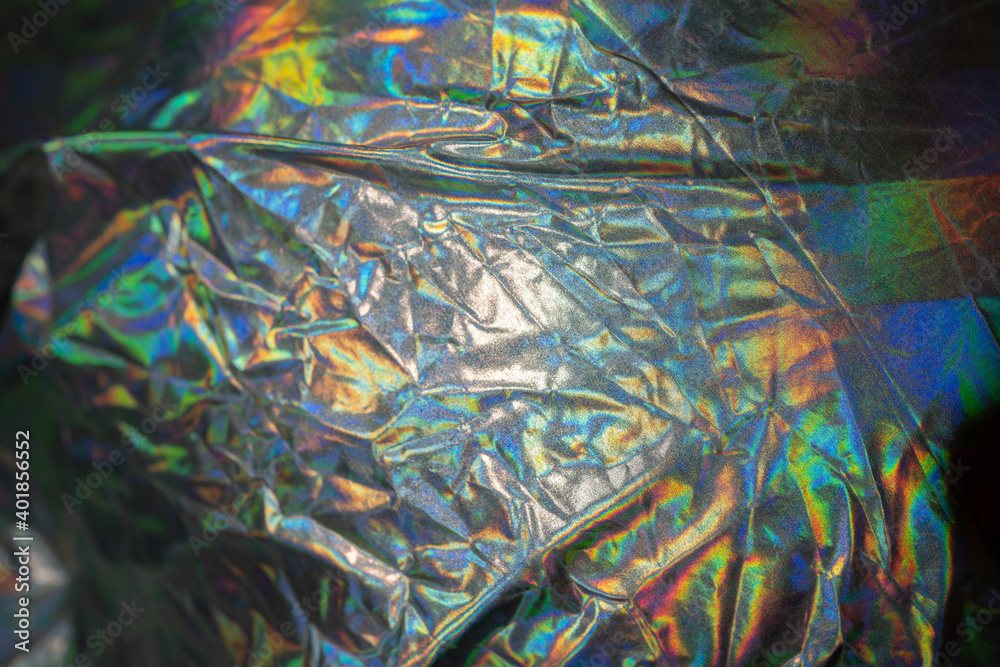 Iridescent fabric trendy cloth holographic background. Colorful chrome fabric. Iridescent fabric trendy cloth holographic background. Colorful chrome fabric.