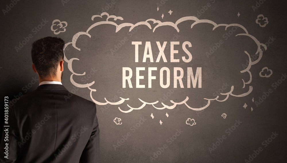 businessman drawing a cloud with TAXES REFORM inscription inside, modern business concept