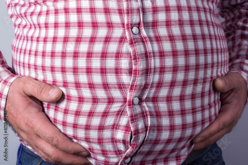 overweight man. Symbolic photo for a beer belly