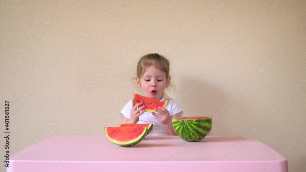 Child and watermelon. Little girl and berry. Baby food. The fruit. High quality 4k footage Child and watermelon. Little girl and berry. Baby food. The fruit. High quality 4k footage